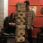 Sheree looks on as Tom slays at Jenga.