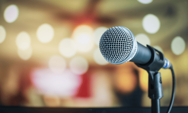 Microphone before blurred audience