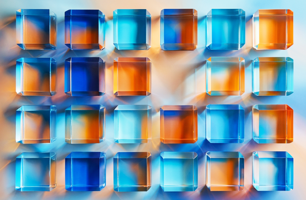 Light going through blue and orange glass prisms.