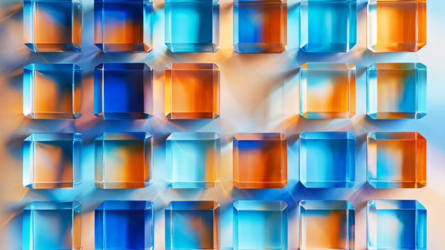 Light going through blue and orange glass prisms.